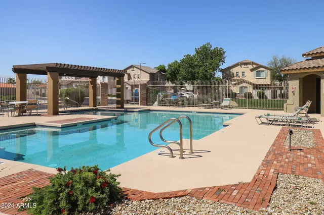 a view of a house with pool porch and chairs