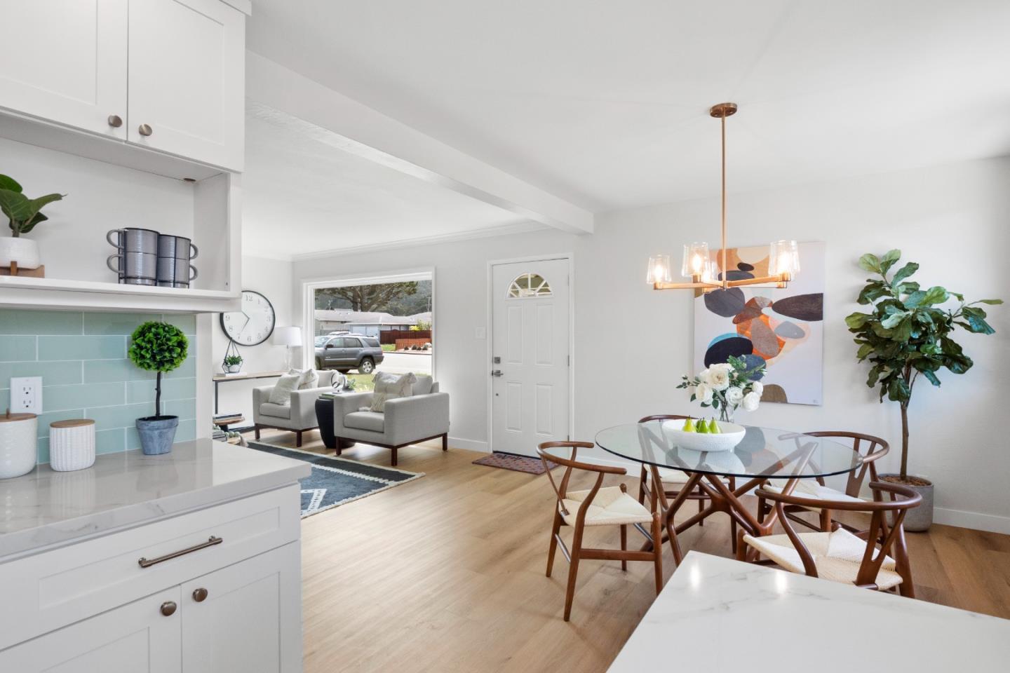 675 Linda Mar Boulevard Pacifica, CA 94044 - Photo 12 of 44 a living room with furniture and potted plants