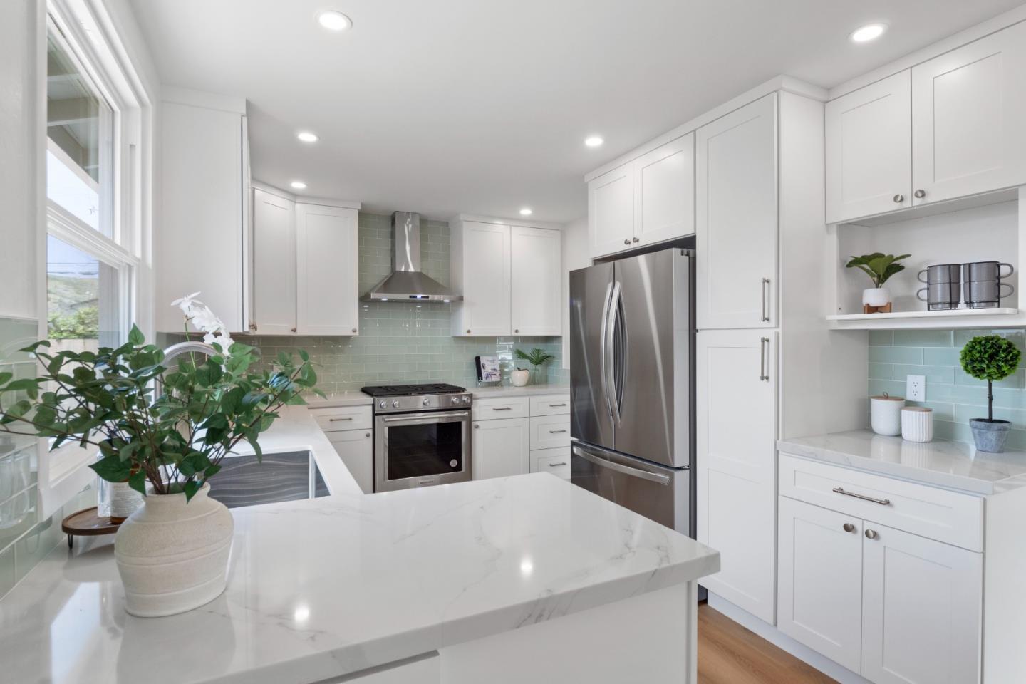675 Linda Mar Boulevard Pacifica, CA 94044 - Photo 13 of 44 a kitchen with counter top space cabinets and stainless steel appliances
