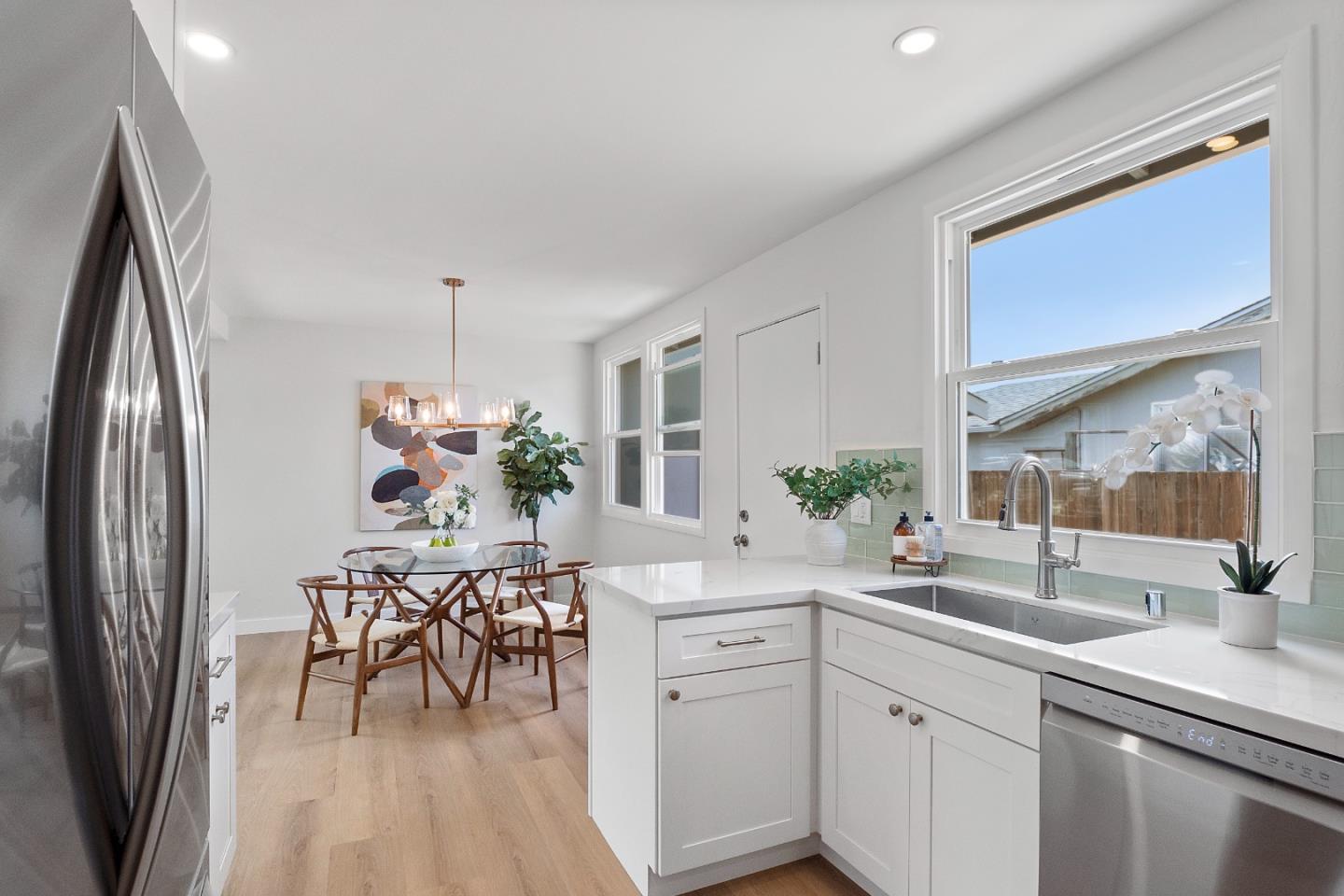 675 Linda Mar Boulevard Pacifica, CA 94044 - Photo 17 of 44 a kitchen with a table and chairs