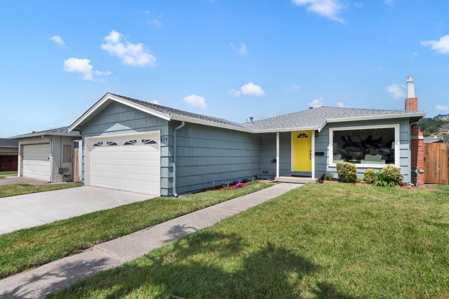 675 Linda Mar Boulevard Pacifica, CA 94044 - Photo 2 of 44 a front view of a house with a yard and garage