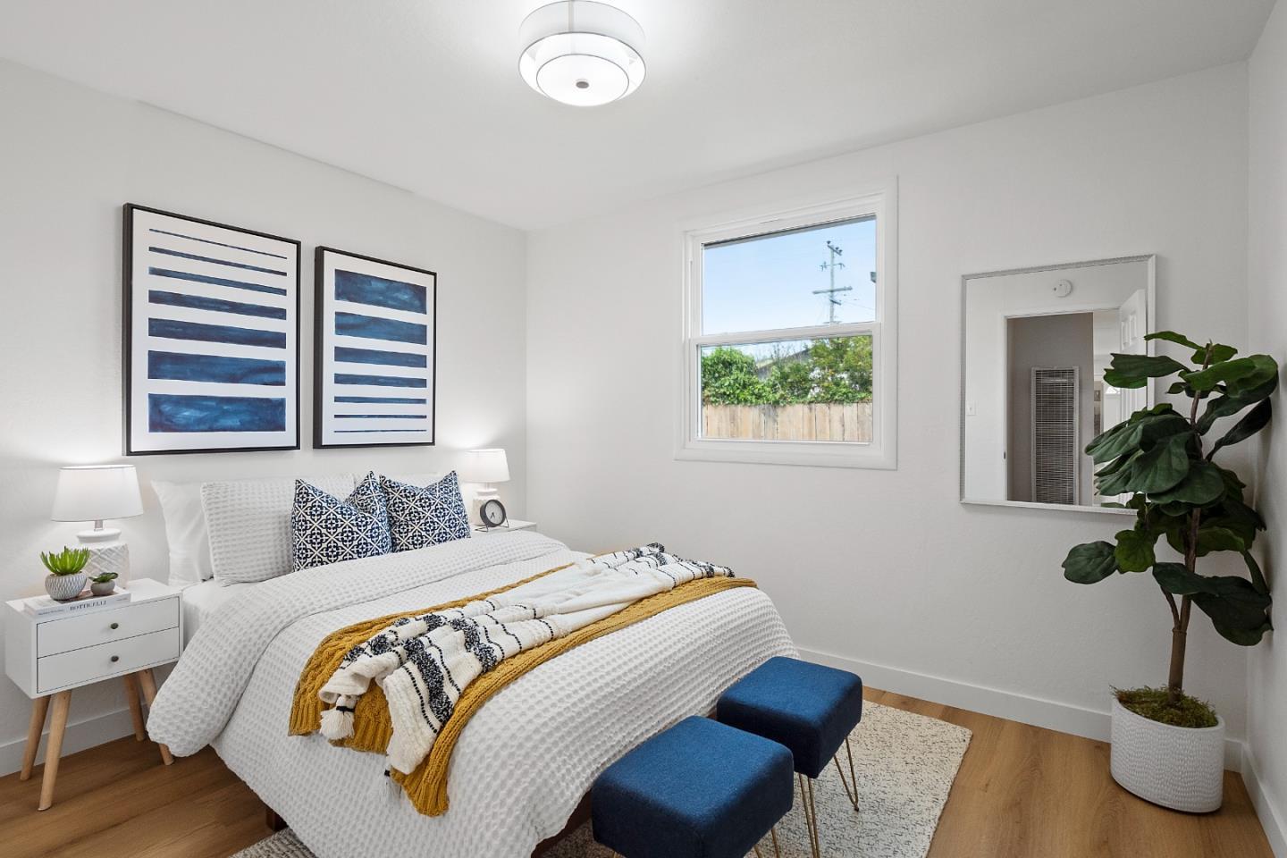 675 Linda Mar Boulevard Pacifica, CA 94044 - Photo 21 of 44 a bedroom with bed and a window