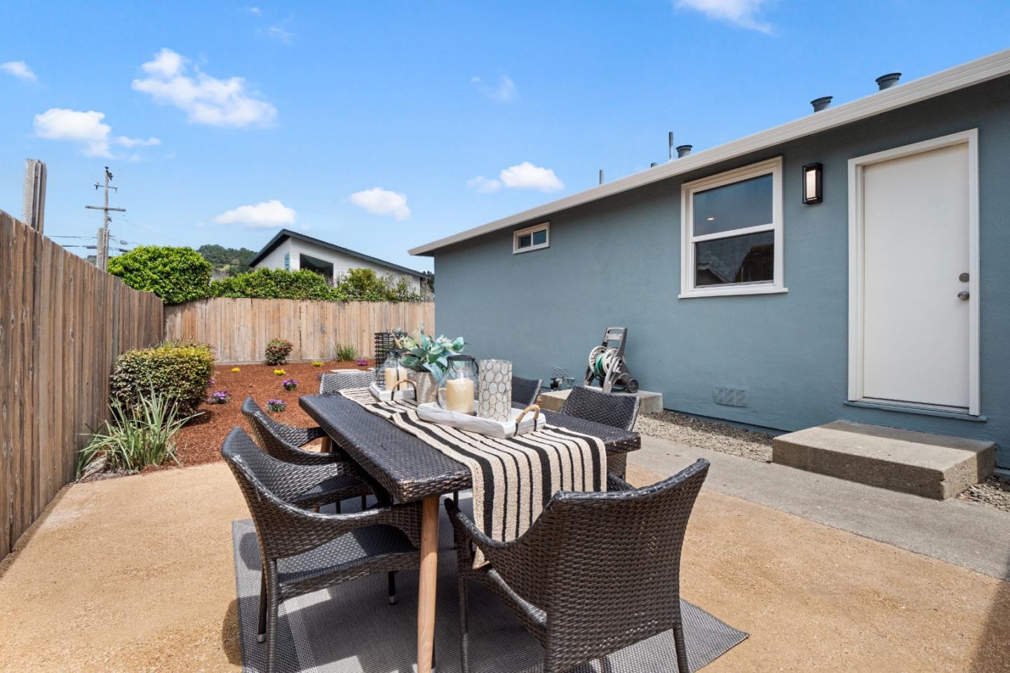 675 Linda Mar Boulevard Pacifica, CA 94044 - Photo 25 of 44 a view of a patio with a yard