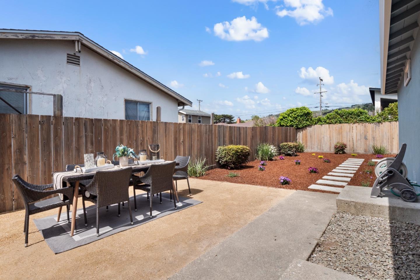 675 Linda Mar Boulevard Pacifica, CA 94044 - Photo 27 of 44 a view of a dinning table and chairs in the patio