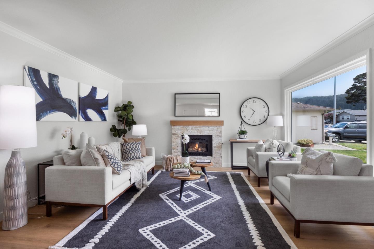 675 Linda Mar Boulevard Pacifica, CA 94044 - Photo 6 of 44 a living room with furniture a rug and a fireplace