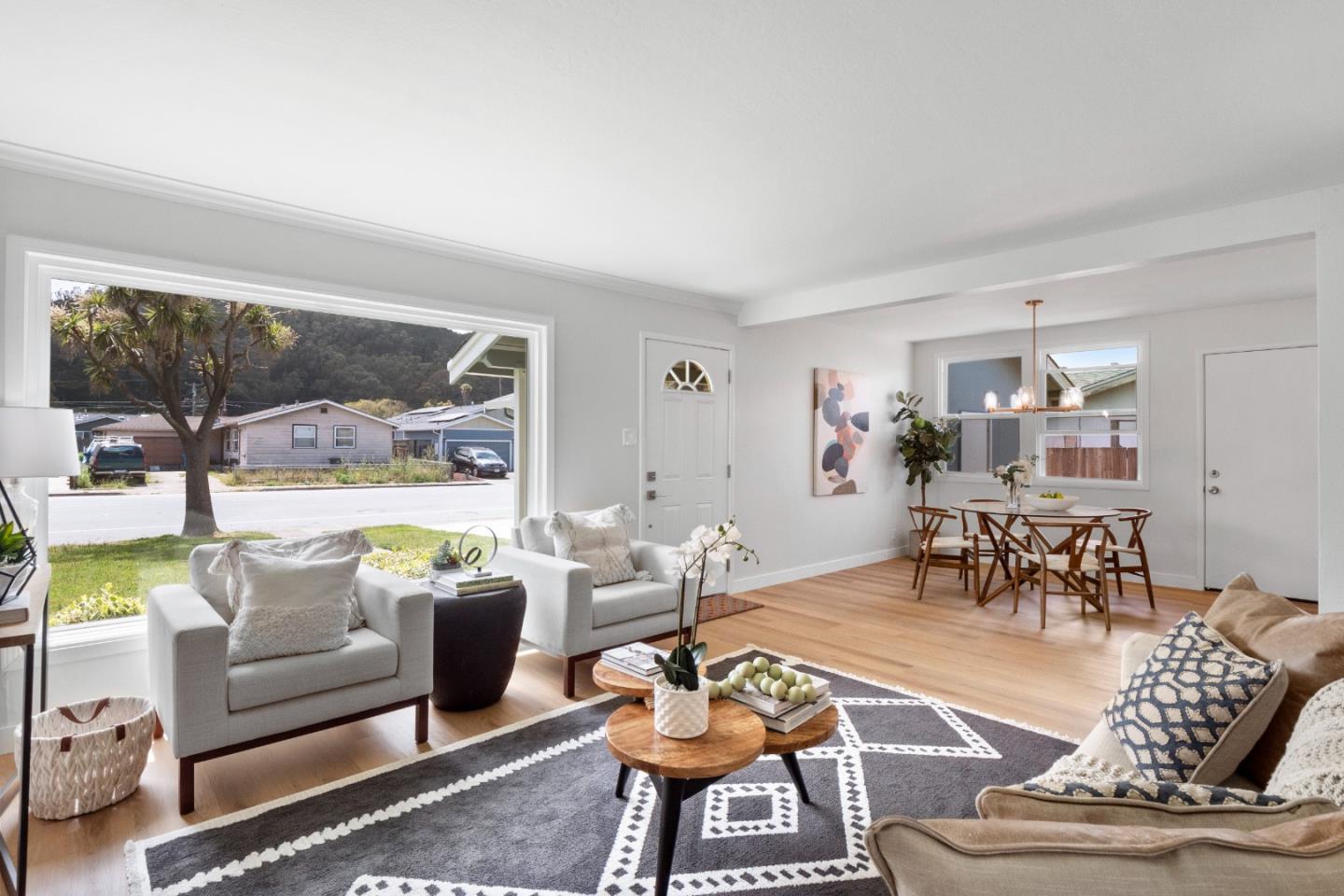 675 Linda Mar Boulevard Pacifica, CA 94044 - Photo 7 of 44 a living room with furniture and a large window