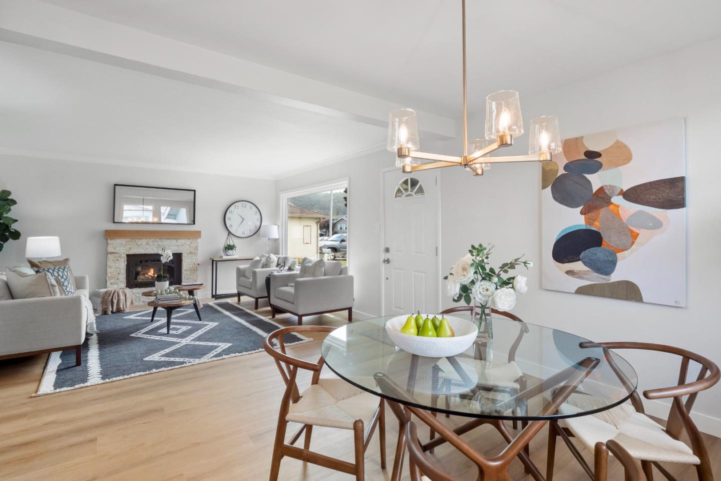 675 Linda Mar Boulevard Pacifica, CA 94044 - Photo 10 of 44 a view of a dining room with furniture a chandelier and wooden floor