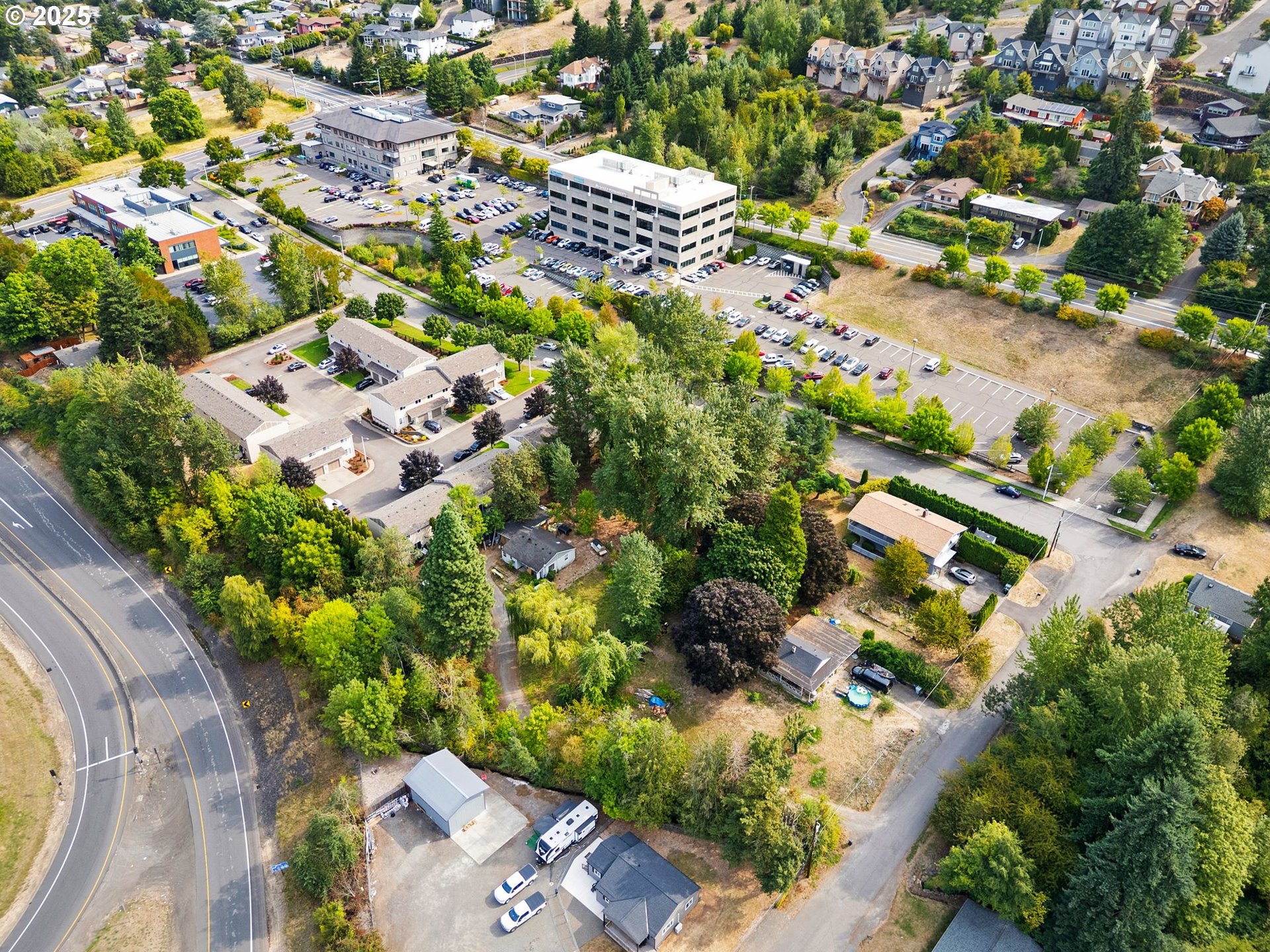 9000 Southeast Con Battin Road Happy Valley, OR 97086 - Photo 12 of 40 an aerial view of a house with a yard and lake view