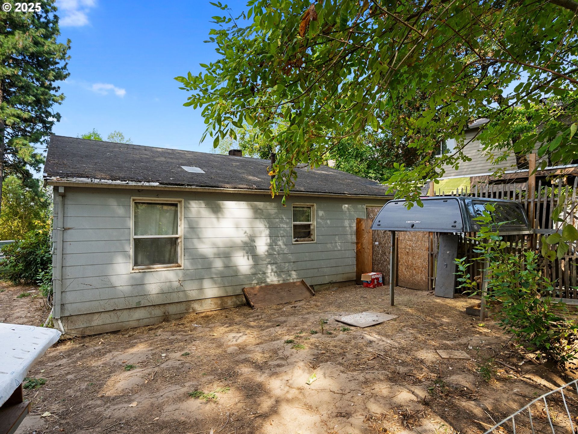 9000 Southeast Con Battin Road Happy Valley, OR 97086 - Photo 18 of 40 a view of a house with a yard and garage