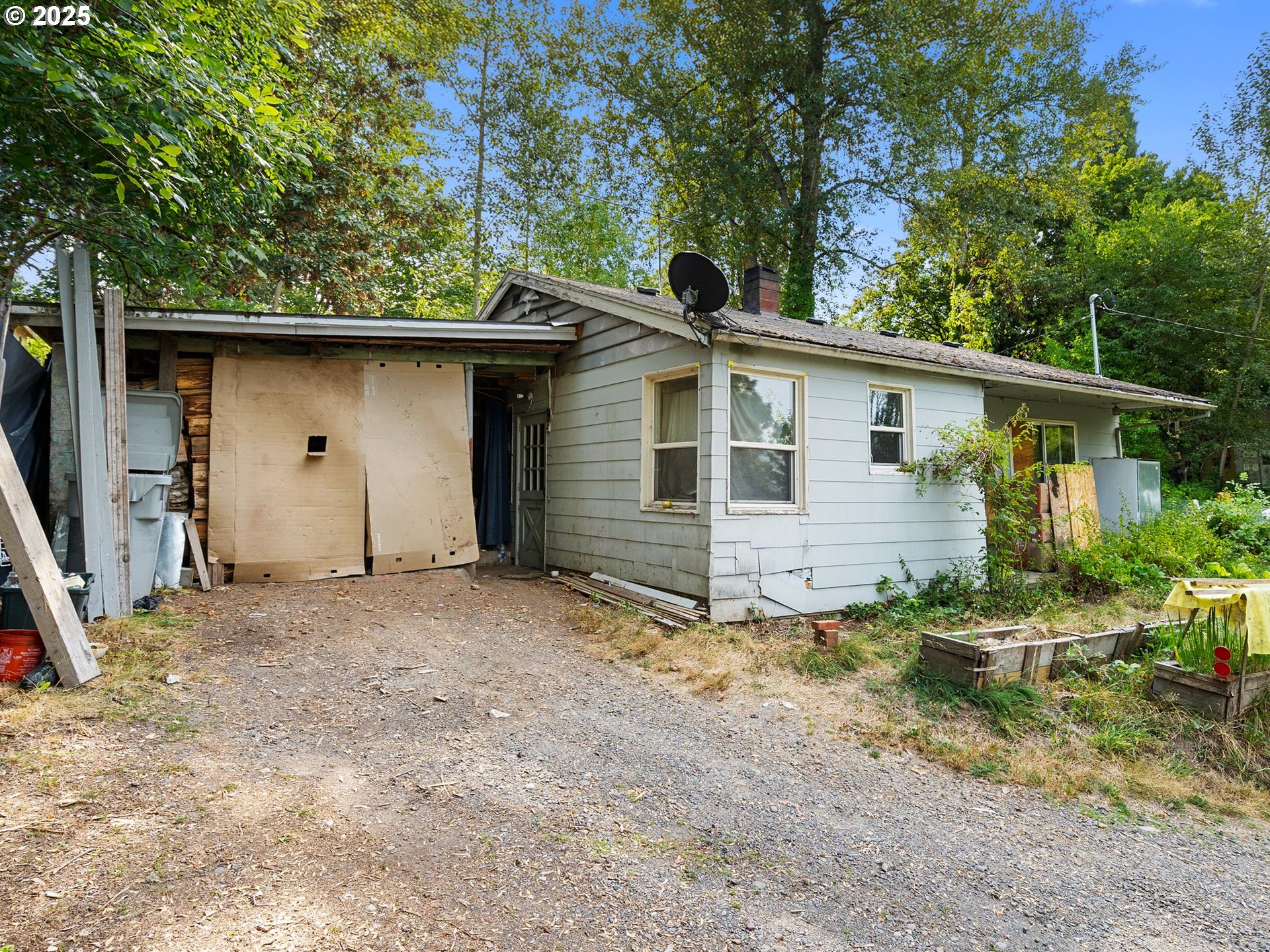 9000 Southeast Con Battin Road Happy Valley, OR 97086 - Photo 21 of 40 a house with trees in the background