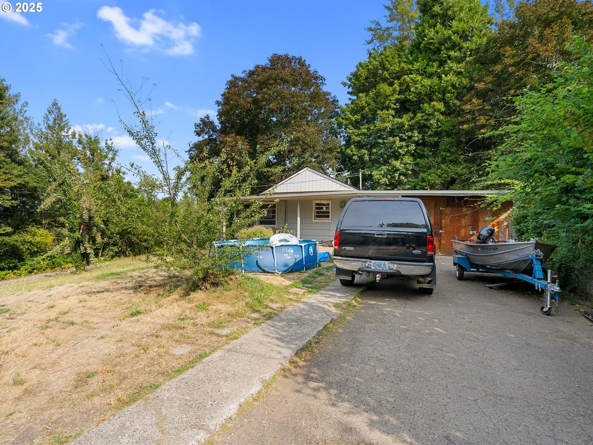 9000 Southeast Con Battin Road Happy Valley, OR 97086 - Photo 23 of 40 a view of a house with backyard and sitting area
