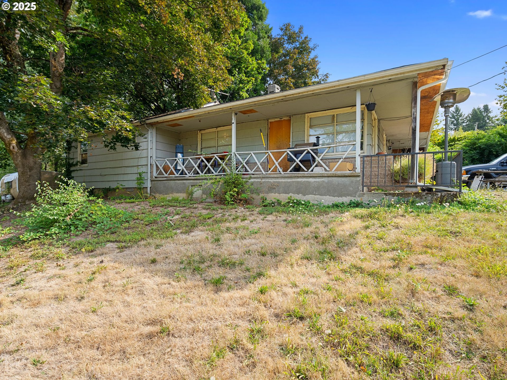 9000 Southeast Con Battin Road Happy Valley, OR 97086 - Photo 26 of 40 a front view of a house with garden