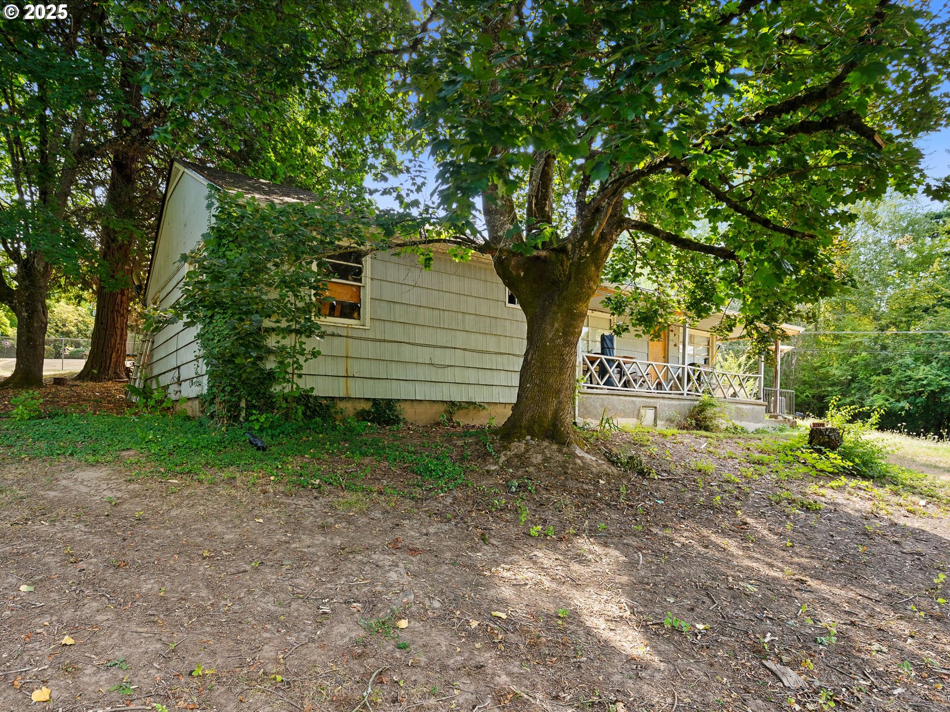 9000 Southeast Con Battin Road Happy Valley, OR 97086 - Photo 28 of 40 a view of a house with a yard