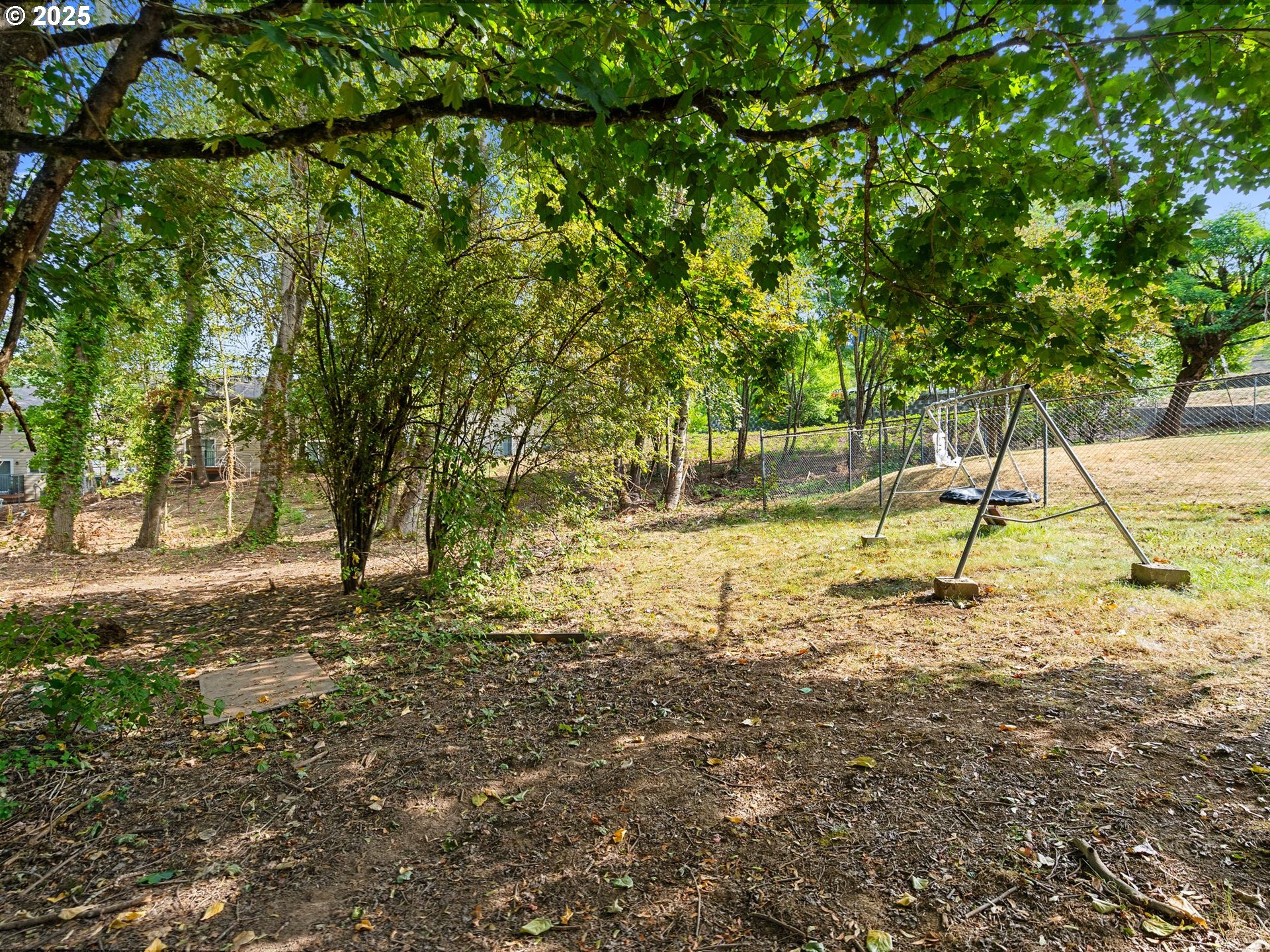 9000 Southeast Con Battin Road Happy Valley, OR 97086 - Photo 29 of 40 a view of a yard with a tree