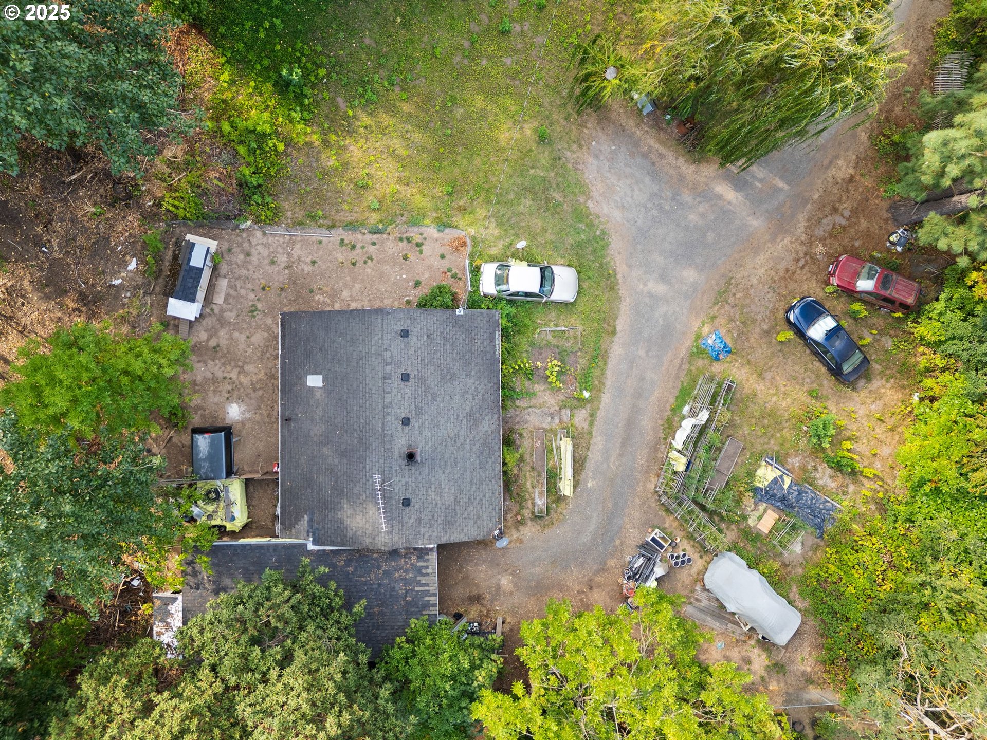 9000 Southeast Con Battin Road Happy Valley, OR 97086 - Photo 3 of 40 an aerial view of a house with a yard and a large tree