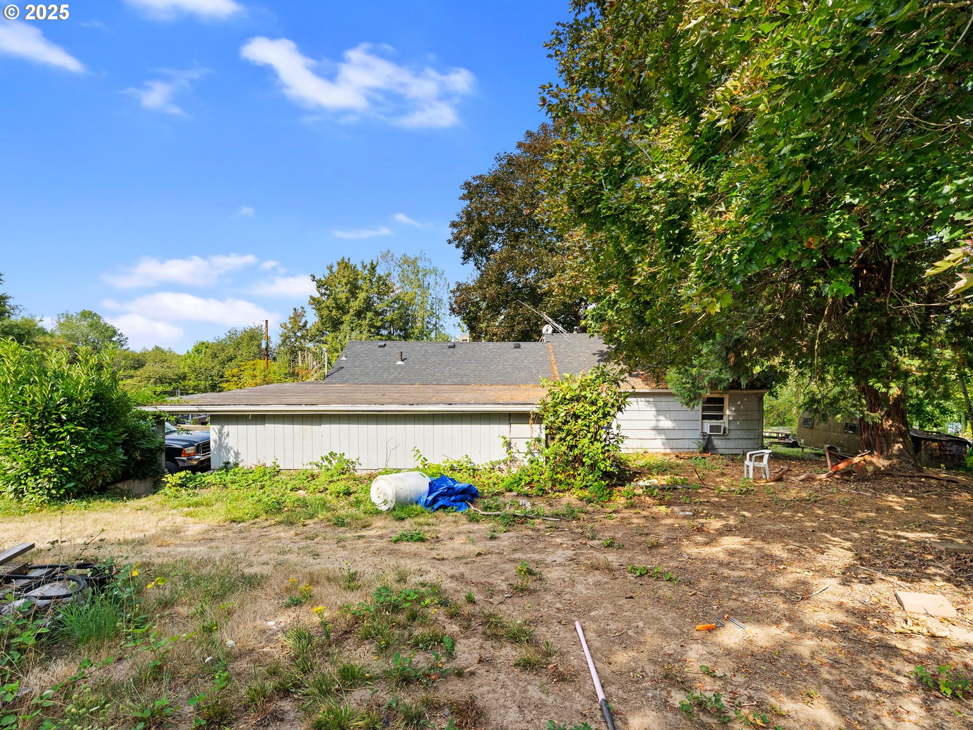 9000 Southeast Con Battin Road Happy Valley, OR 97086 - Photo 38 of 40 a front view of a house with garden