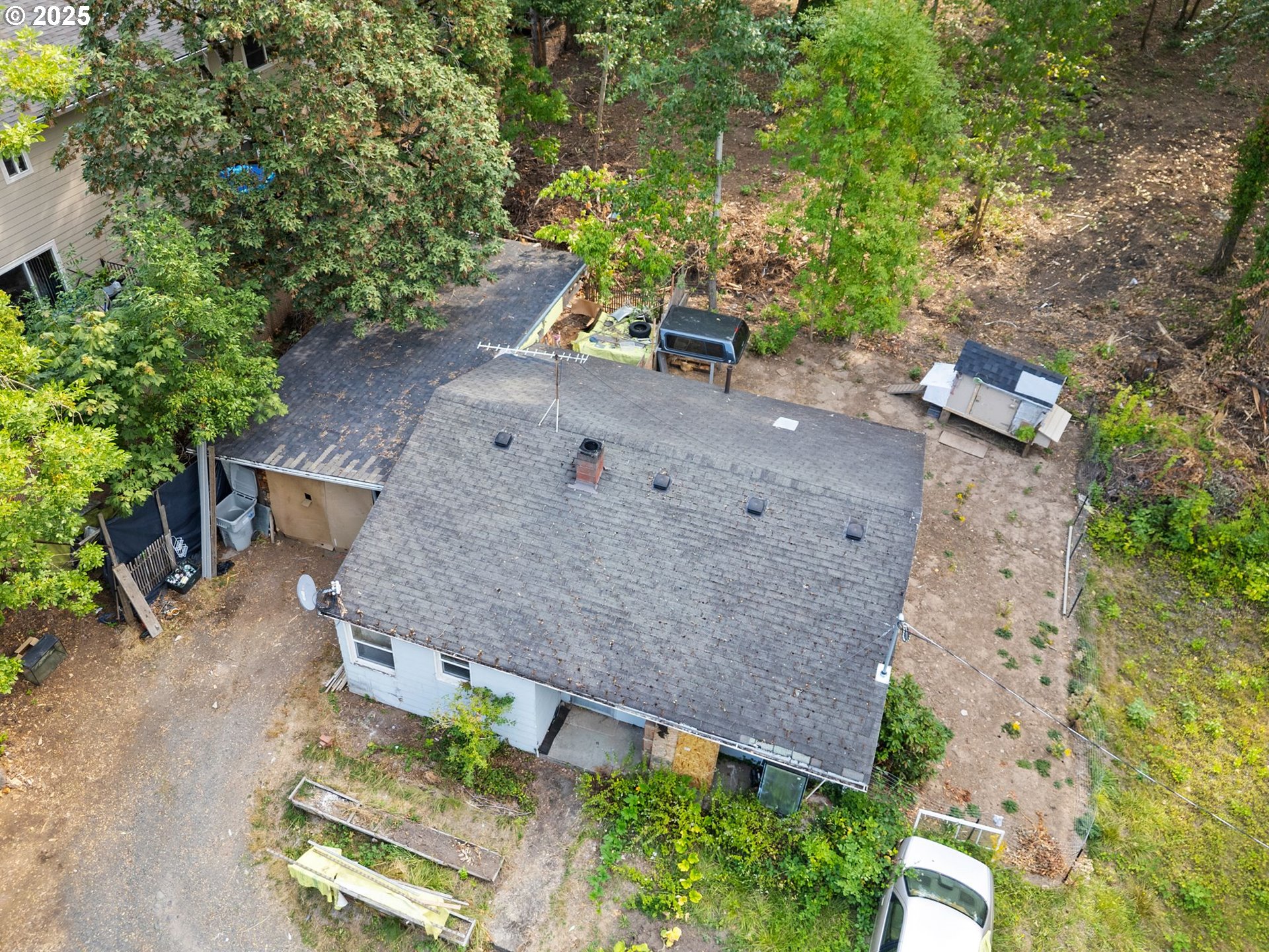 9000 Southeast Con Battin Road Happy Valley, OR 97086 - Photo 4 of 40 an aerial view of a house with a yard and wooden fence