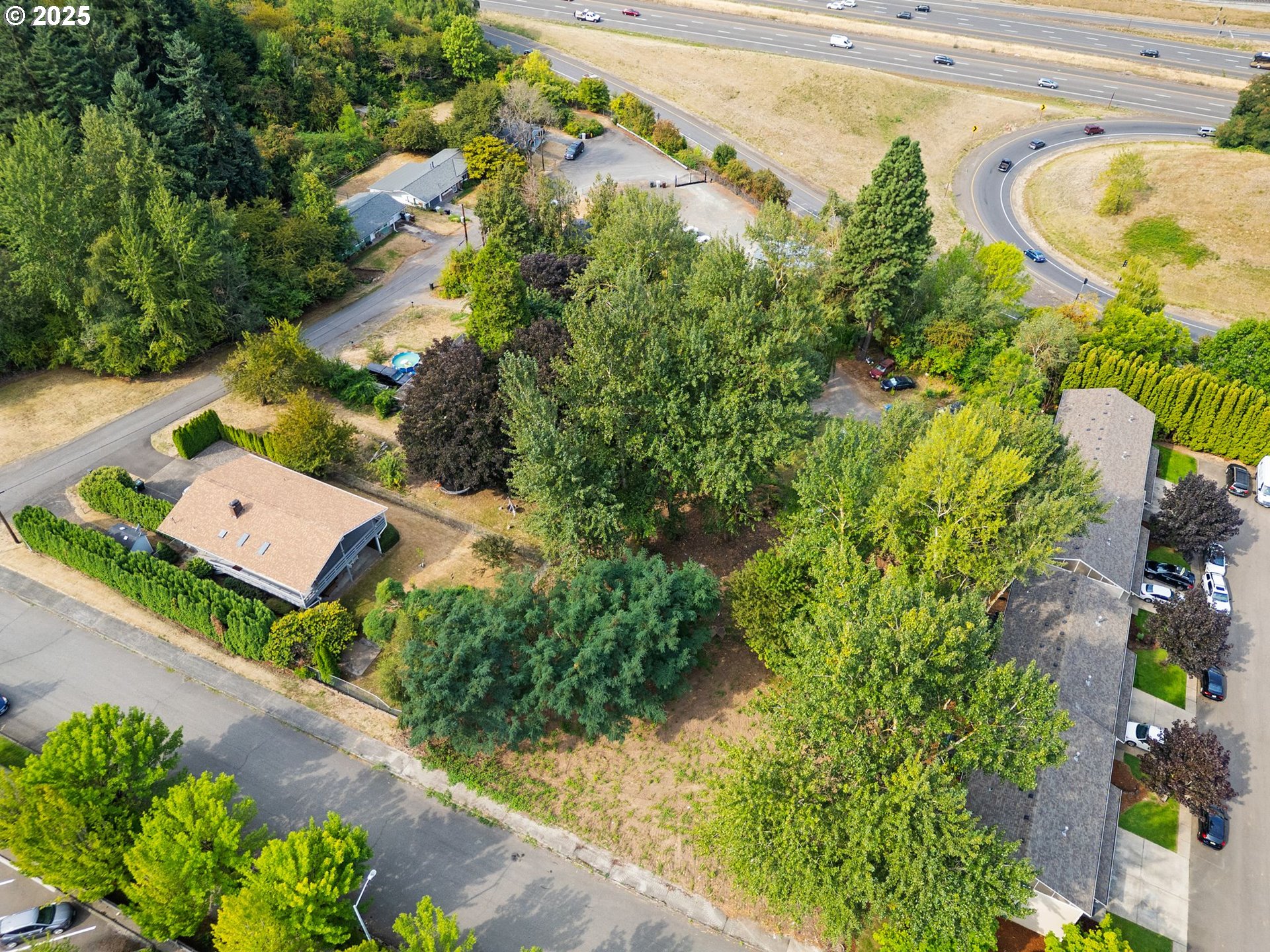 9000 Southeast Con Battin Road Happy Valley, OR 97086 - Photo 8 of 40 an aerial view of a house with a yard and lake view
