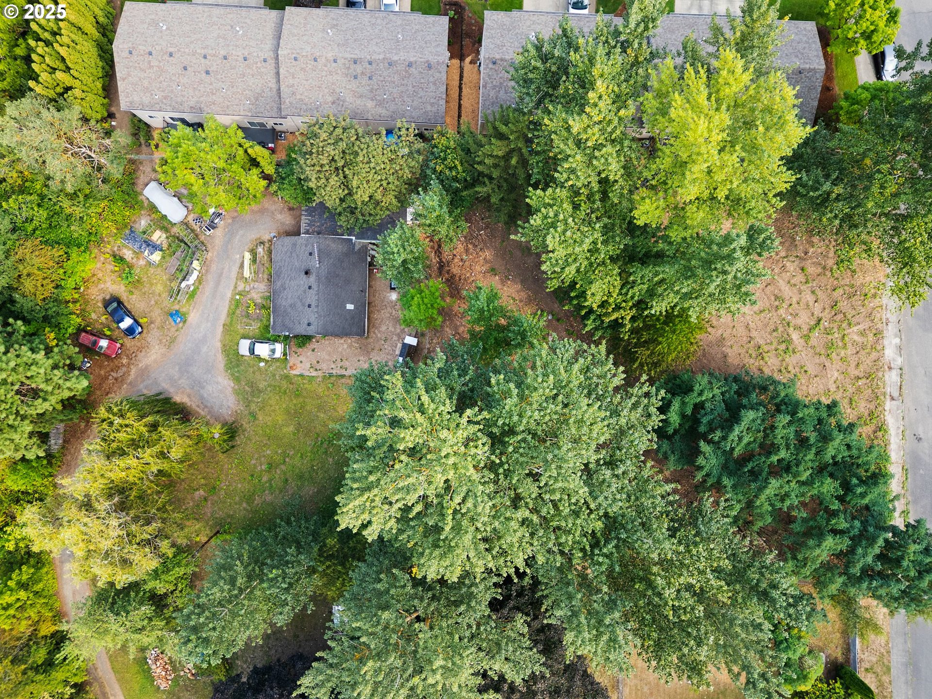 9000 Southeast Con Battin Road Happy Valley, OR 97086 - Photo 9 of 40 an aerial view of a house with a garden and yard