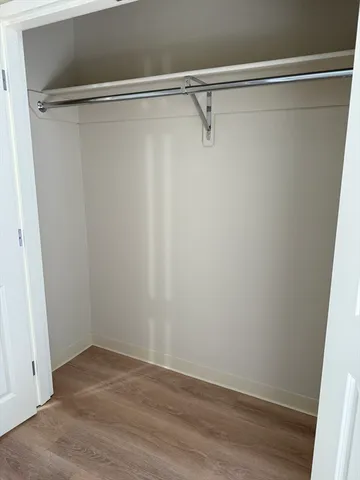 a view of a room with wooden floor and small space