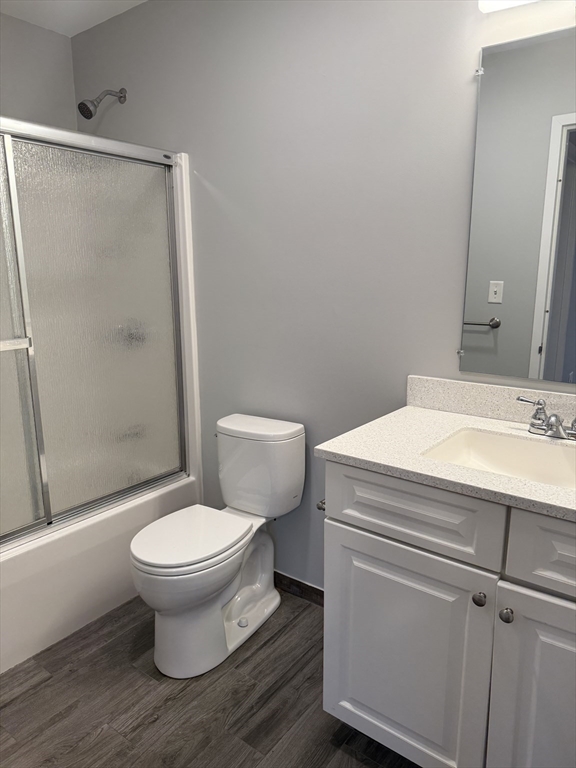 10 Florence Street, Unit 309 Malden, MA 02148 - Photo 10 of 15 a bathroom with a sink toilet and shower