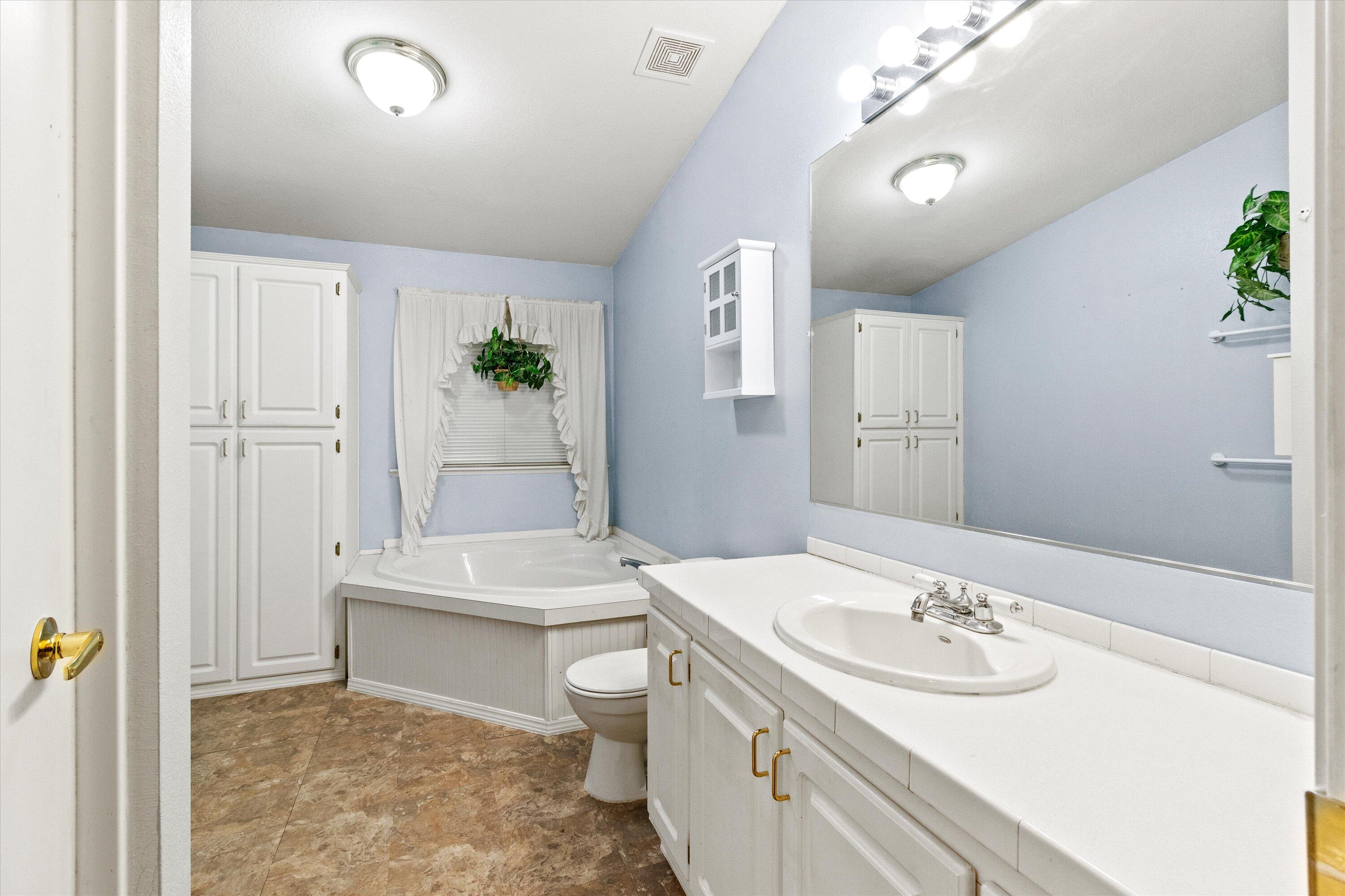 535 Round Prairie Road Wilderville, OR 97543 - Photo 15 of 31 Primary bathroom includes a step in shower and a soaking tub.