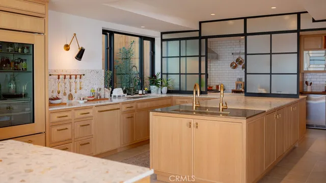 a kitchen with stainless steel appliances granite countertop a sink and a stove