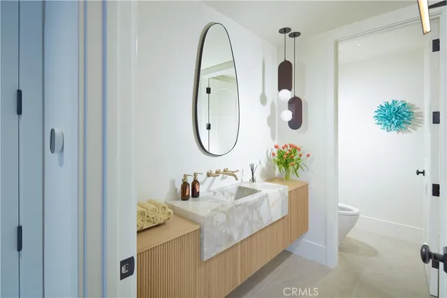 a bedroom with a large bed and a balcony