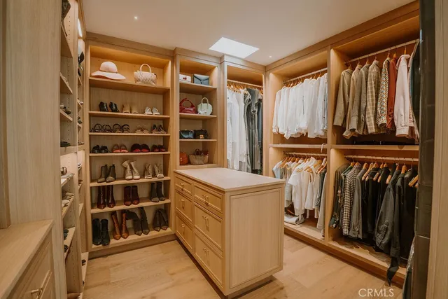 a bedroom with a large bed and a large window