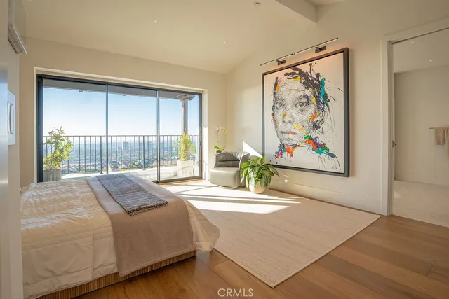 a bedroom with a bed and a mirror