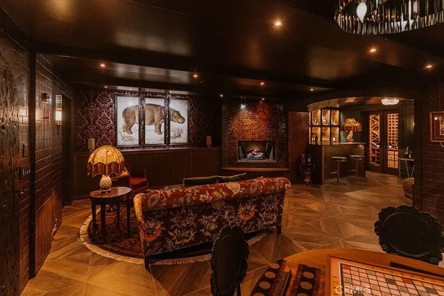 a living room with furniture cabinets and window