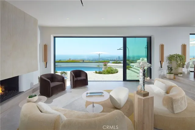 a living room with furniture and flowers