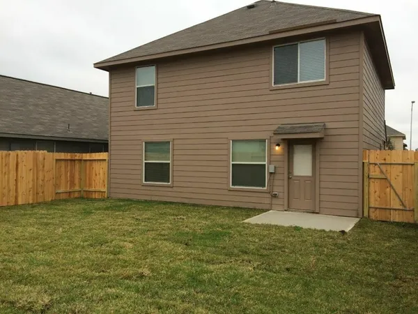 a view of backyard of a house