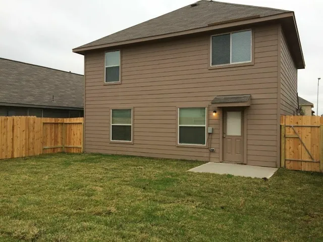 a view of backyard of a house