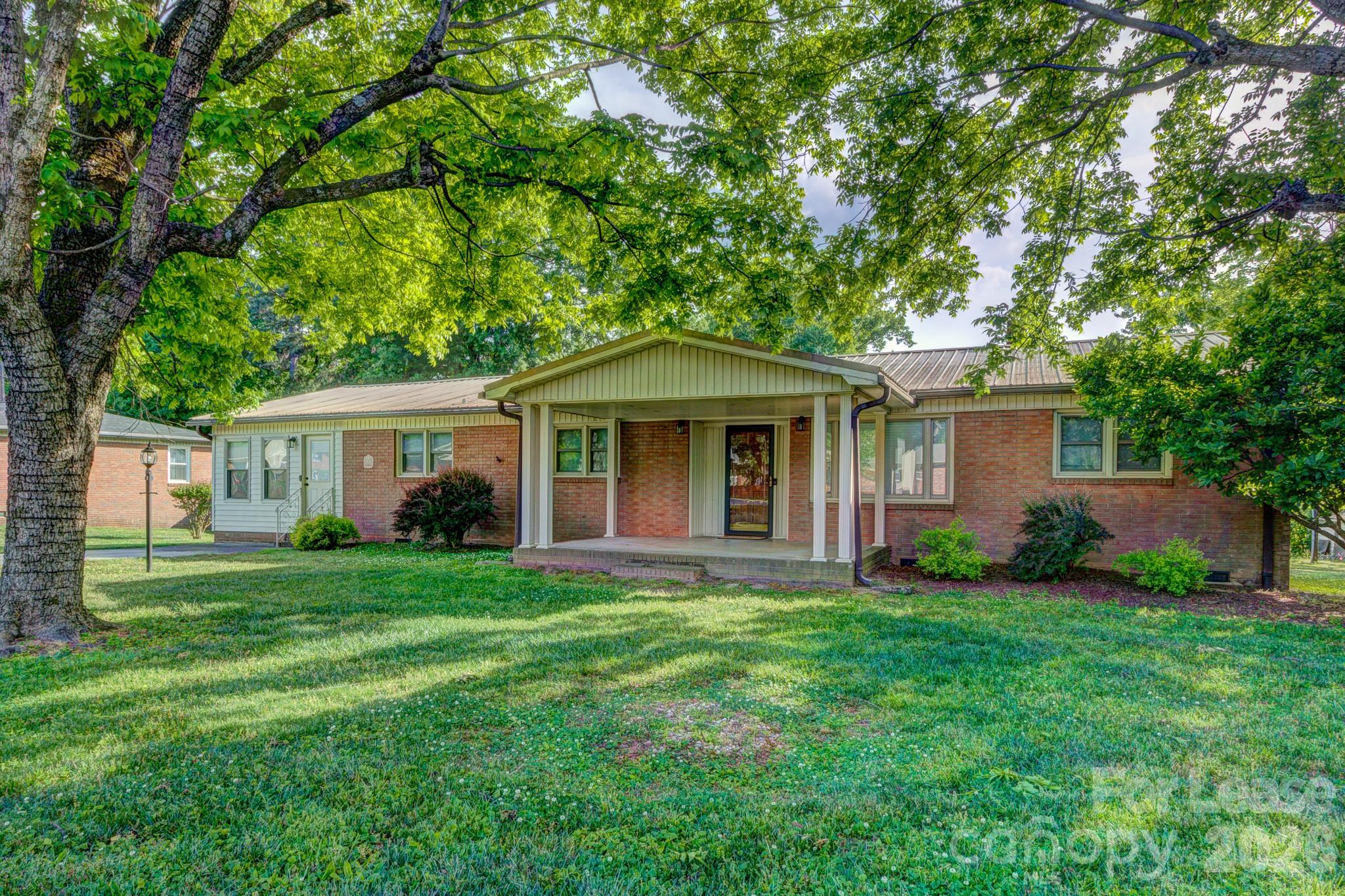 1409 Delview Road Cherryville, NC 28021 - Photo 1 of 19 front view of a house and a yard