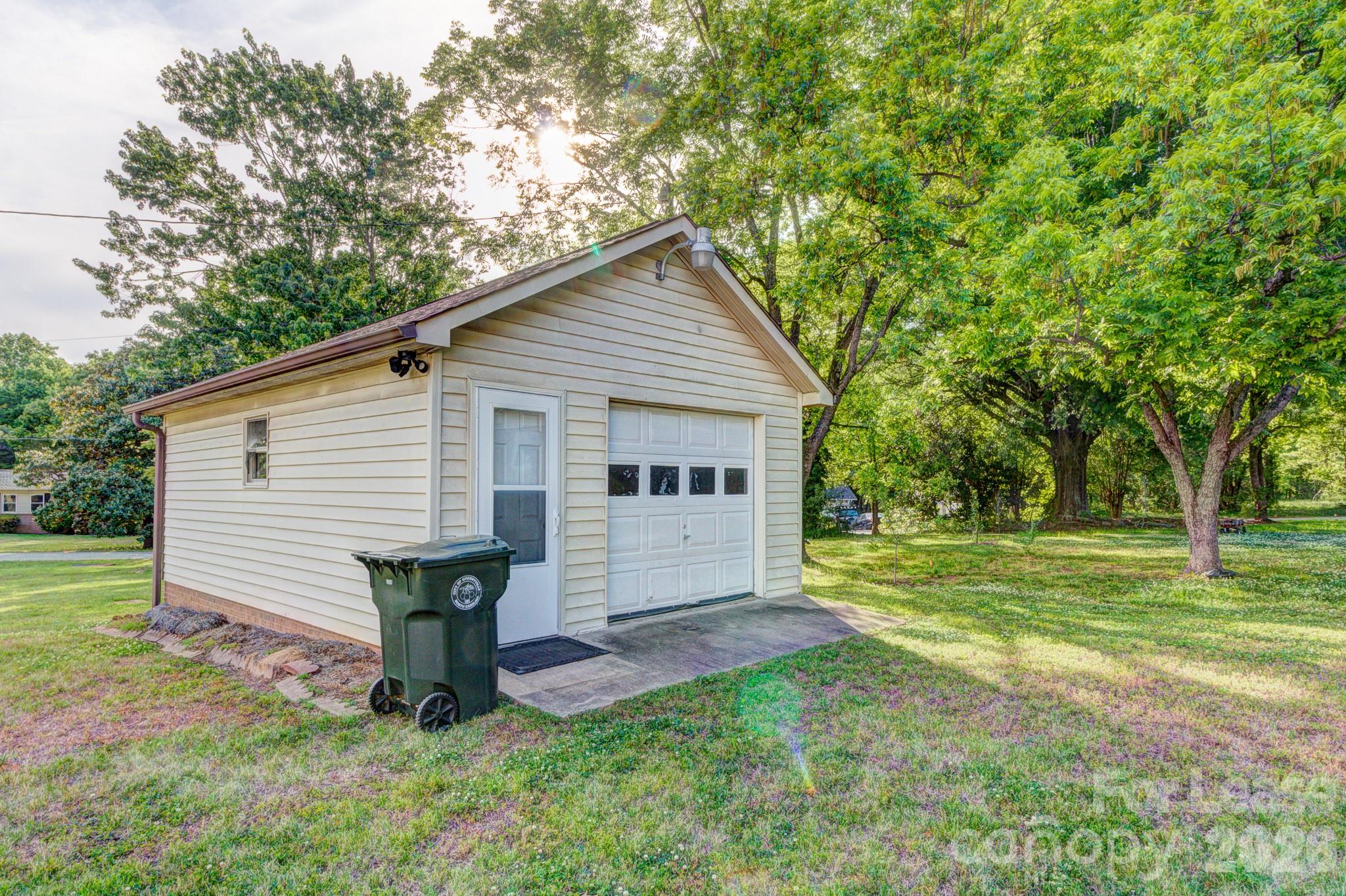 1409 Delview Road Cherryville, NC 28021 - Photo 19 of 19 a view of a house with backyard and a tree