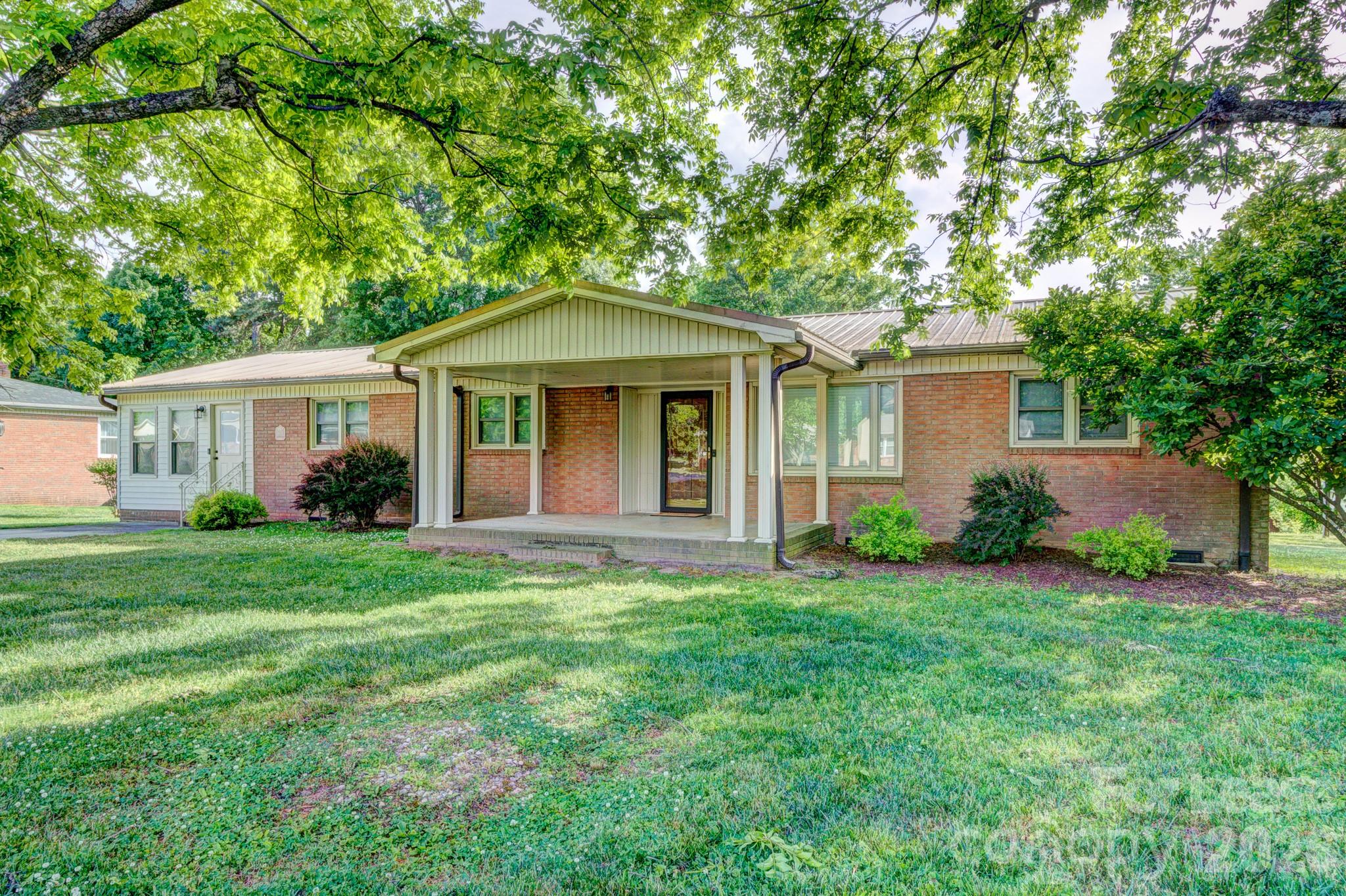 1409 Delview Road Cherryville, NC 28021 - Photo 2 of 19 front view of a house and a yard