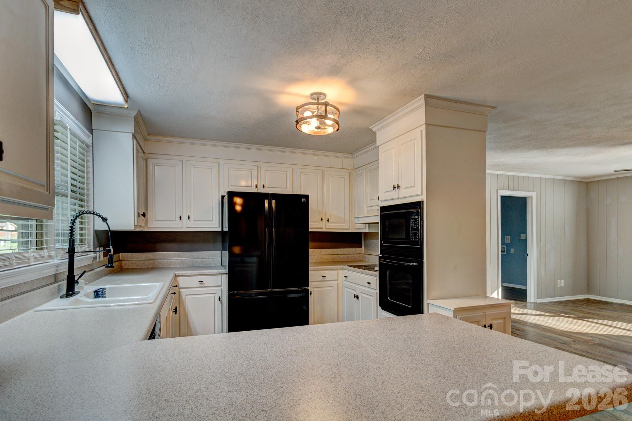 1409 Delview Road Cherryville, NC 28021 - Photo 5 of 19 a kitchen with refrigerator and cabinets