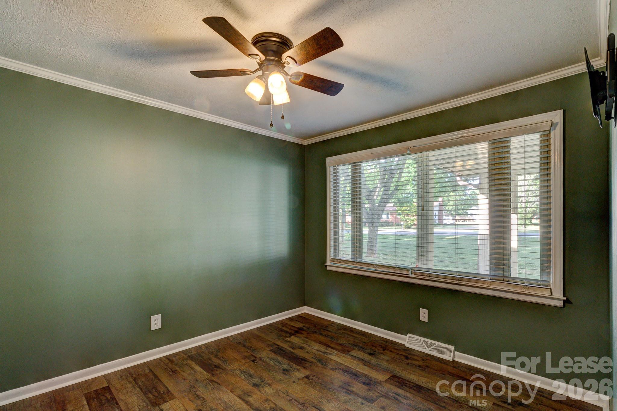 1409 Delview Road Cherryville, NC 28021 - Photo 8 of 19 an empty room with a window and a ceiling fan