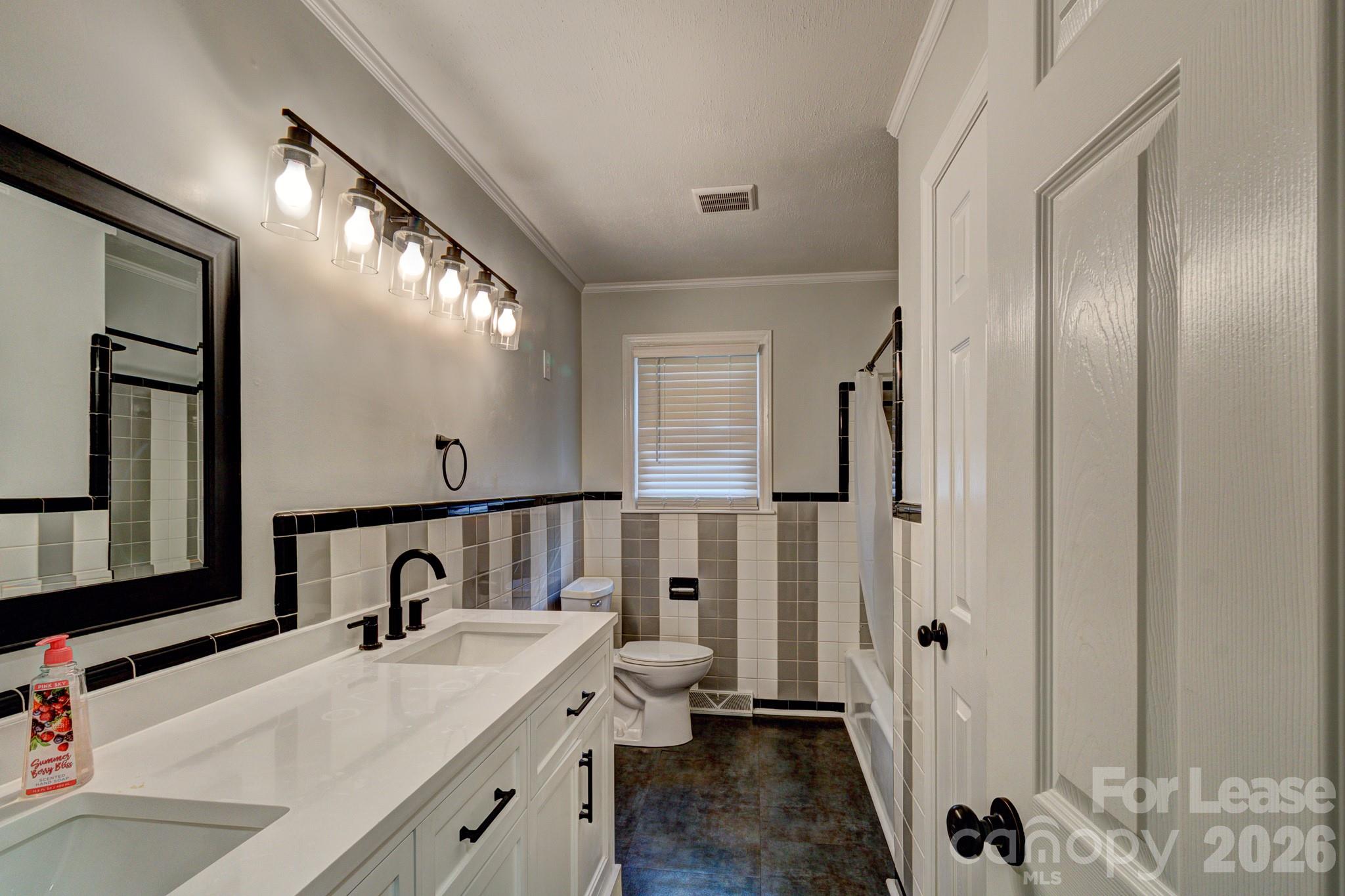 1409 Delview Road Cherryville, NC 28021 - Photo 9 of 19 a bathroom with a double vanity sink and mirror