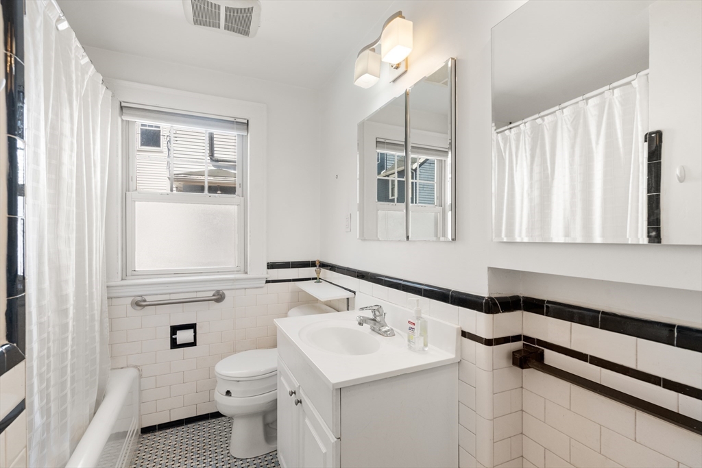 9 Searle Avenue Brookline, MA 02445 - Photo 12 of 35 a bathroom with a sink toilet and window