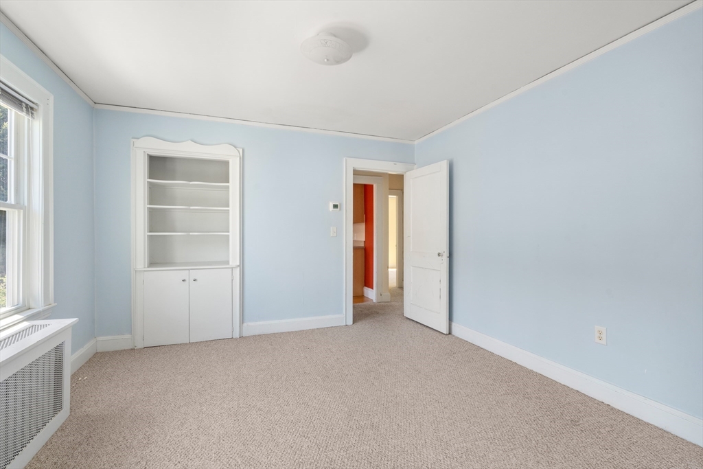 9 Searle Avenue Brookline, MA 02445 - Photo 24 of 35 an empty room with windows and closet