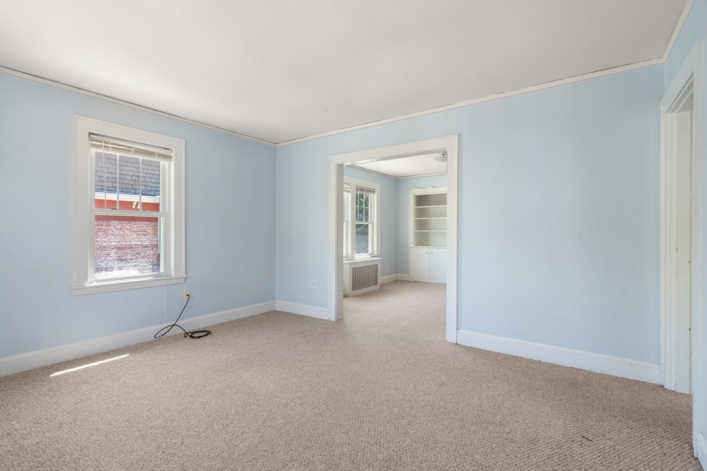 9 Searle Avenue Brookline, MA 02445 - Photo 26 of 35 an empty room with windows and closet