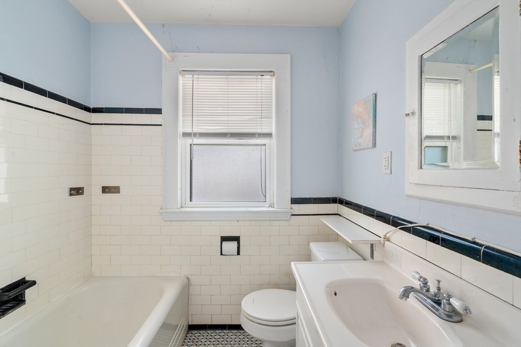 9 Searle Avenue Brookline, MA 02445 - Photo 28 of 35 a bathroom with a sink a toilet and shower