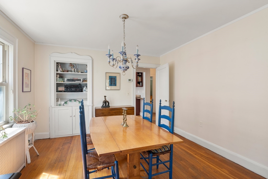 9 Searle Avenue Brookline, MA 02445 - Photo 4 of 35 a view of a dining room with furniture and wooden floor