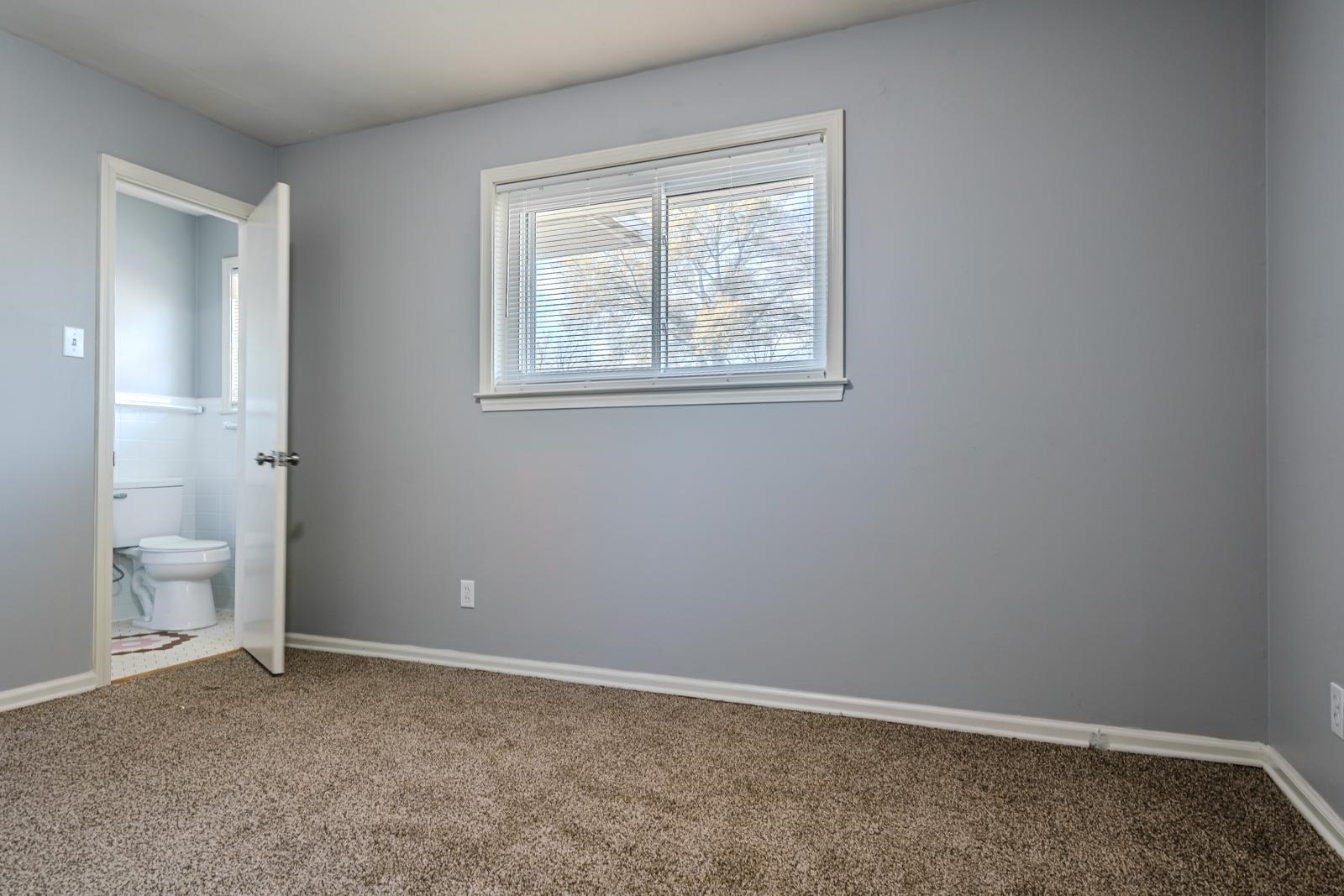 4202 Ambrose Road Memphis, TN 38116 - Photo 19 of 28 a view of an empty room with a window