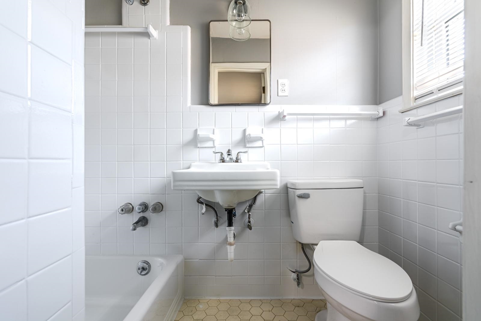 4202 Ambrose Road Memphis, TN 38116 - Photo 20 of 28 a bathroom with a sink toilet and shower
