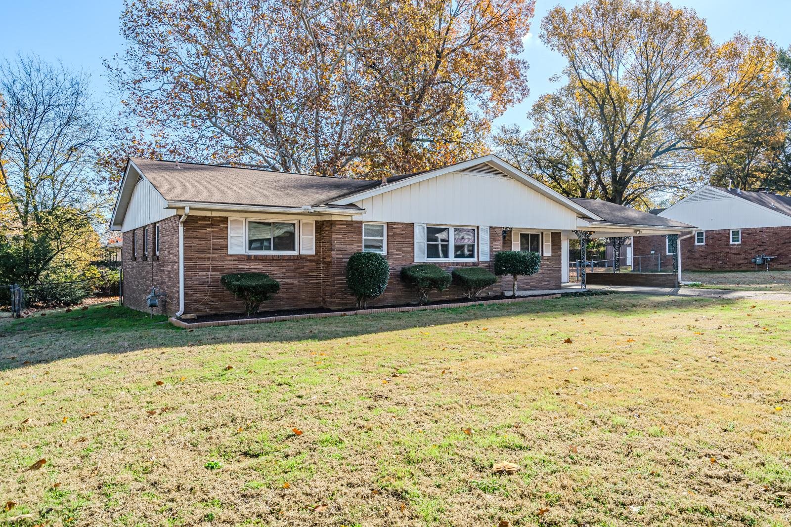 4202 Ambrose Road Memphis, TN 38116 - Photo 2 of 28 a front view of a house with a yard