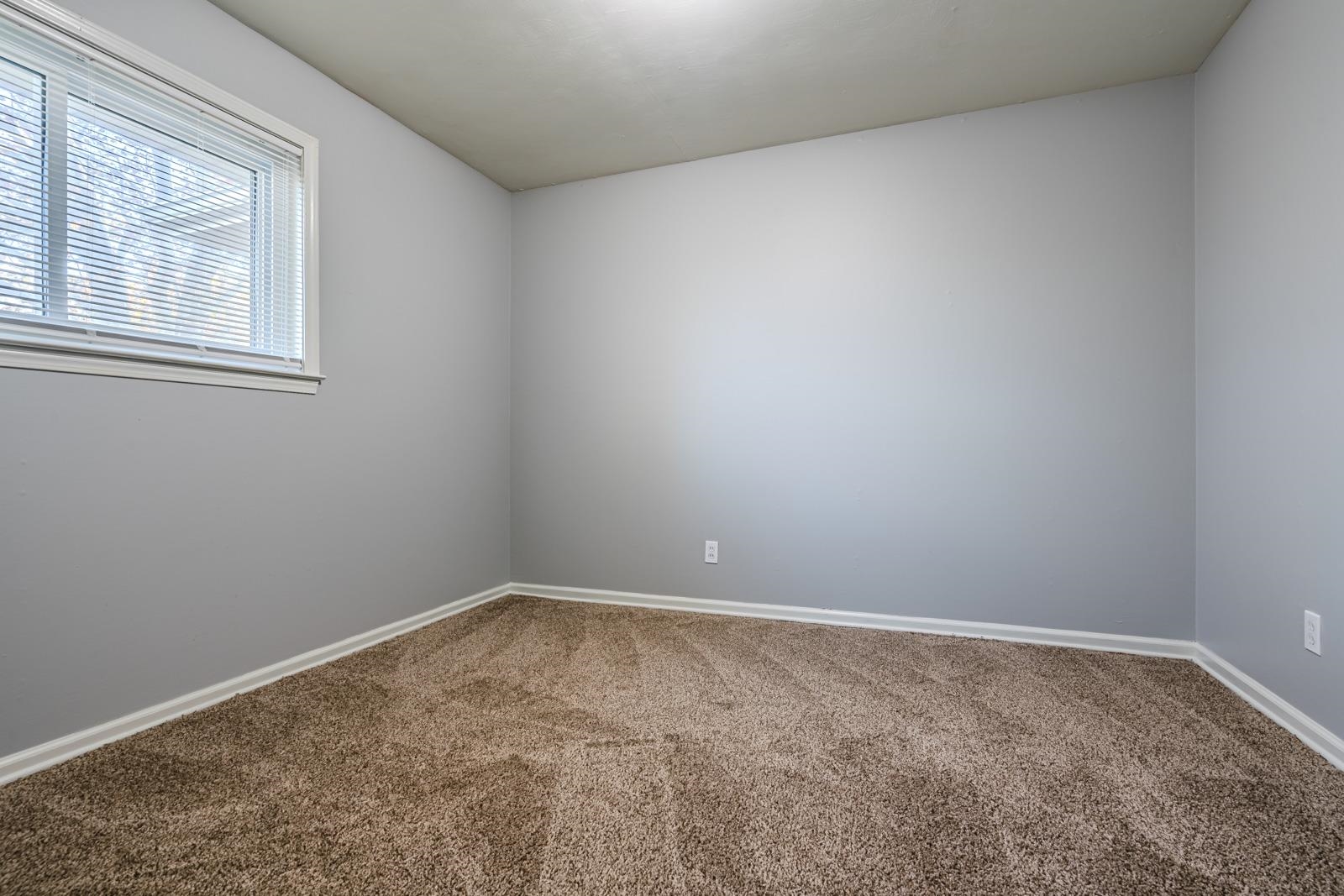 4202 Ambrose Road Memphis, TN 38116 - Photo 22 of 28 an empty room with a window