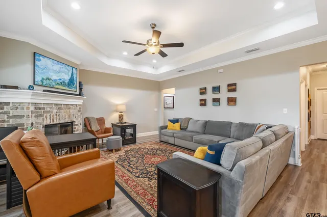 a living room with furniture and a fireplace